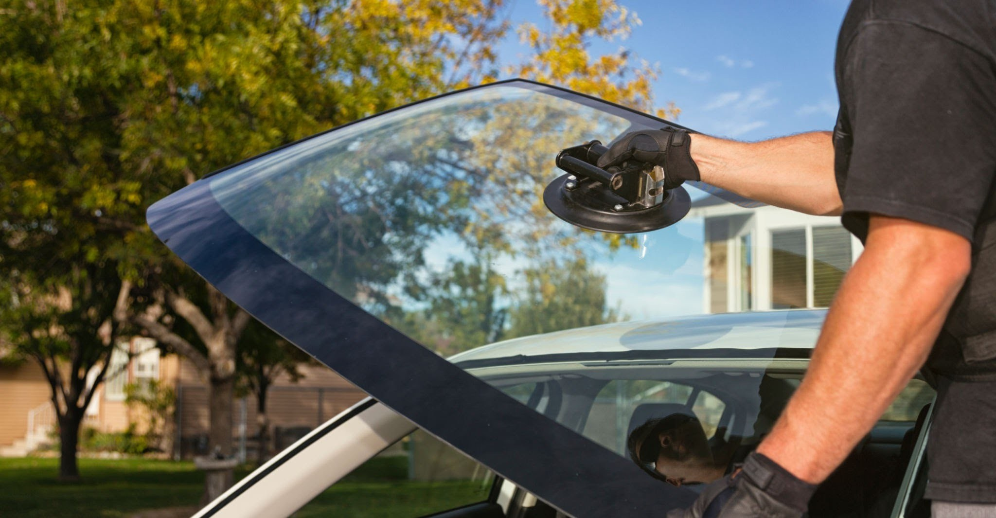 Experienced auto glass technician installing windshield in Las Vegas