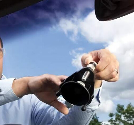 Technician performing windshield chip repair in Ventura County